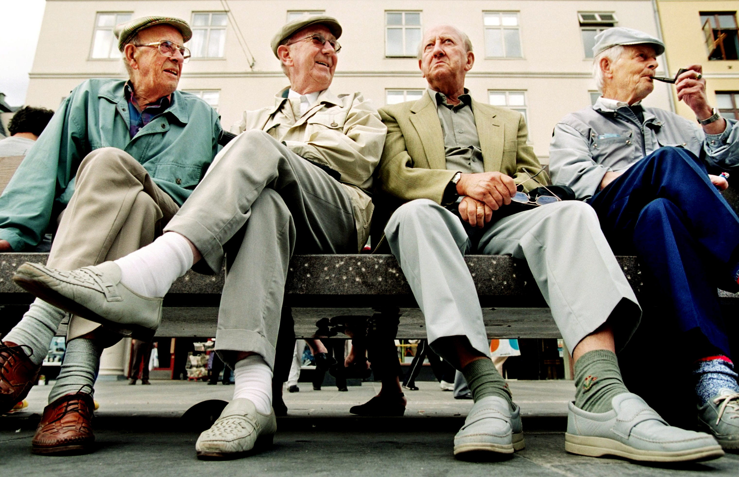 For elderly men sitting on a bench