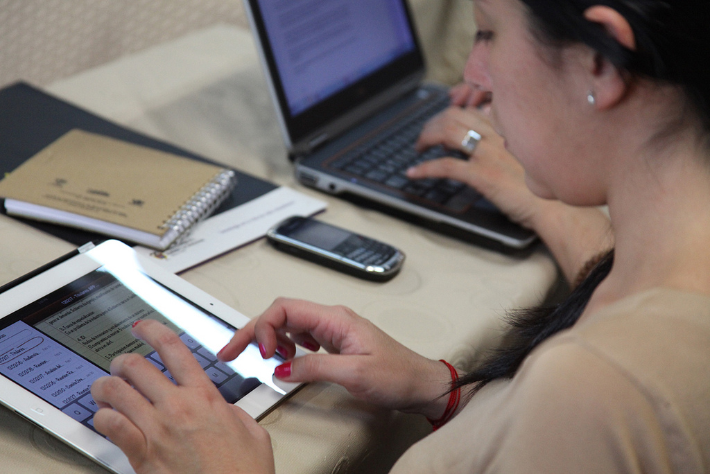 A woman using a tablet computer